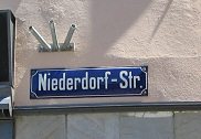 Road sign "Niederdorfstrasse"
                        ("Downtown Street")