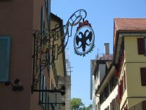 Hirschenplatz (Stag Square), Hotel Adler
                        (Eagle Hotel) with the shield of an eagle