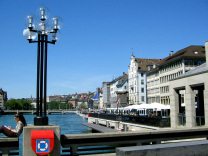 Rathausbr�cke (Town Hall Bridge) with
                        lantern, sight of Limmat Quay to Zurich Main
                        Station