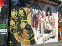 Zurich, Zollstrasse (Customs
                                Street), graffiti with a hand, with a
                                man, and with a naked woman in a sitting
                                position