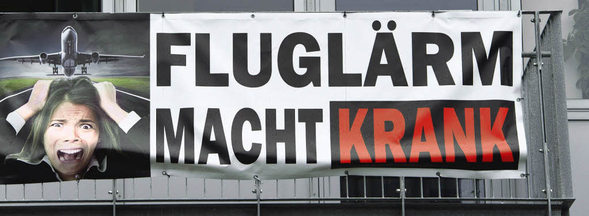 Transparent "Flugl�rm
                        macht krank", Beispiel vom Flughafen
                        Frankfurt