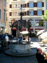 Zurich, Weinplatz (Wine Square),
                        Buttenmnnchenbrunnen (Tub Man Fountain) at
                        Stork Hotel
