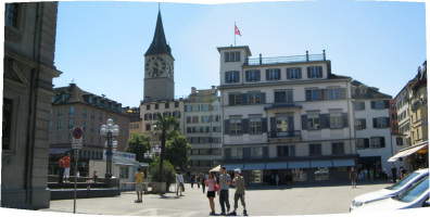 Zurich, Rathausbrcke (Town Hall Bridge),
                        sight of St. Peter's Church and row of houses,
                        panorama photo