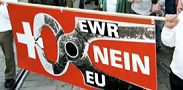 Poster
                                      of SVP of Abcherli with black
                                      tongs as a symbol for EEA and EU
                                      against Switzerland, EEA and EU
                                      are deliberately presented in
                                      black