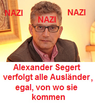Nazi
                        graphic artist Alexander Segert, portrait with
                        Nazi stamp: This Nazi graphic artist Segert is
                        pursuing any foreigners not important from where
                        they come