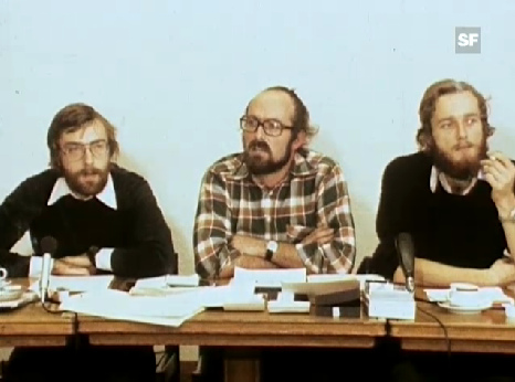 Journalist Mr. Jrg
                    Frischknecht (middle) from "Democratic
                    Manifesto" (DM) at a press conference of 1976
                    presenting the "Cincera syndrome"
