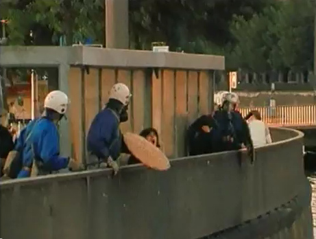 Zurich
                          Station Quay (Bahnhofquai), the trapped woman
                          is hit by rubber bullets, she is screaming and
                          sinking down, evening of Sep. 4, 1980