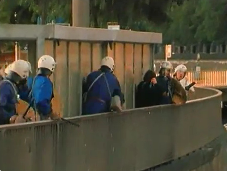 Zurich Station
                            Quay (Bahnhofquai), criminal Zurich bully
                            policeman is hitting the helpless woman on
                            her breast who was already hit by rubber
                            bullets, evening of Sep. 4, 1980