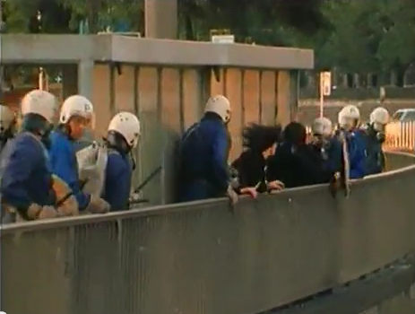 Zurich Station
                            Quay (Bahnhofquai), criminal Zurich bully
                            police is hitting the helpless woman from
                            behind who was already hit by rubber
                            bullets, and the woman is moving forward
                            with violence, evening of Sep. 4, 1980