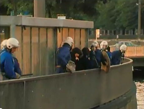 Zurich Station
                          Quay (Bahnhofquai), the helpless women is
                          evading the criminal violator Zurich policeman
                          but this Swiss Nazi beast in blue is coming
                          along with her, evening of Sep. 4, 1980