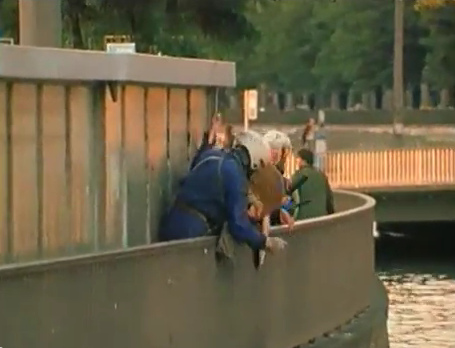 Zurich Station
                            Quay (Bahnhofquai), the criminal Zurich
                            violator bully policeman is taking the woman
                            at her neck hitting her face a third time at
                            the railing, she can protect her face a
                            third time with her arms with pain and
                            misery, evening of Sep. 4, 1980