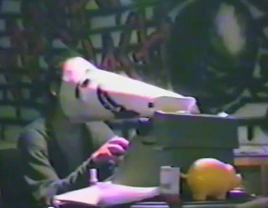 Squatting at Baden
                            Street N� 2, a person with bird mask at a
                            type writer