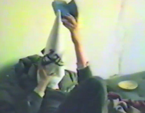 Squatting at Baden Street N� 2, a persons
                          is reading a blue book