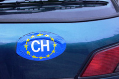 Sticker EU-Switzerland
                        (Confoederatio Helvetica) at a car with a barbed
                        wire