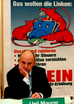 Das Rattenplakat
der Nazi-SVP gegen die
Mehrwertsteuererhöhung für die AHV /
IV-Versicherung mit dem Präsidenten der
SVP, Ueli Maurer Das Rattenplakat der Nazi-SVP gegen
die Mehrwertsteuererhöhung für die AHV /
IV-Versicherung mit dem Präsidenten der
SVP, Ueli Maurer
